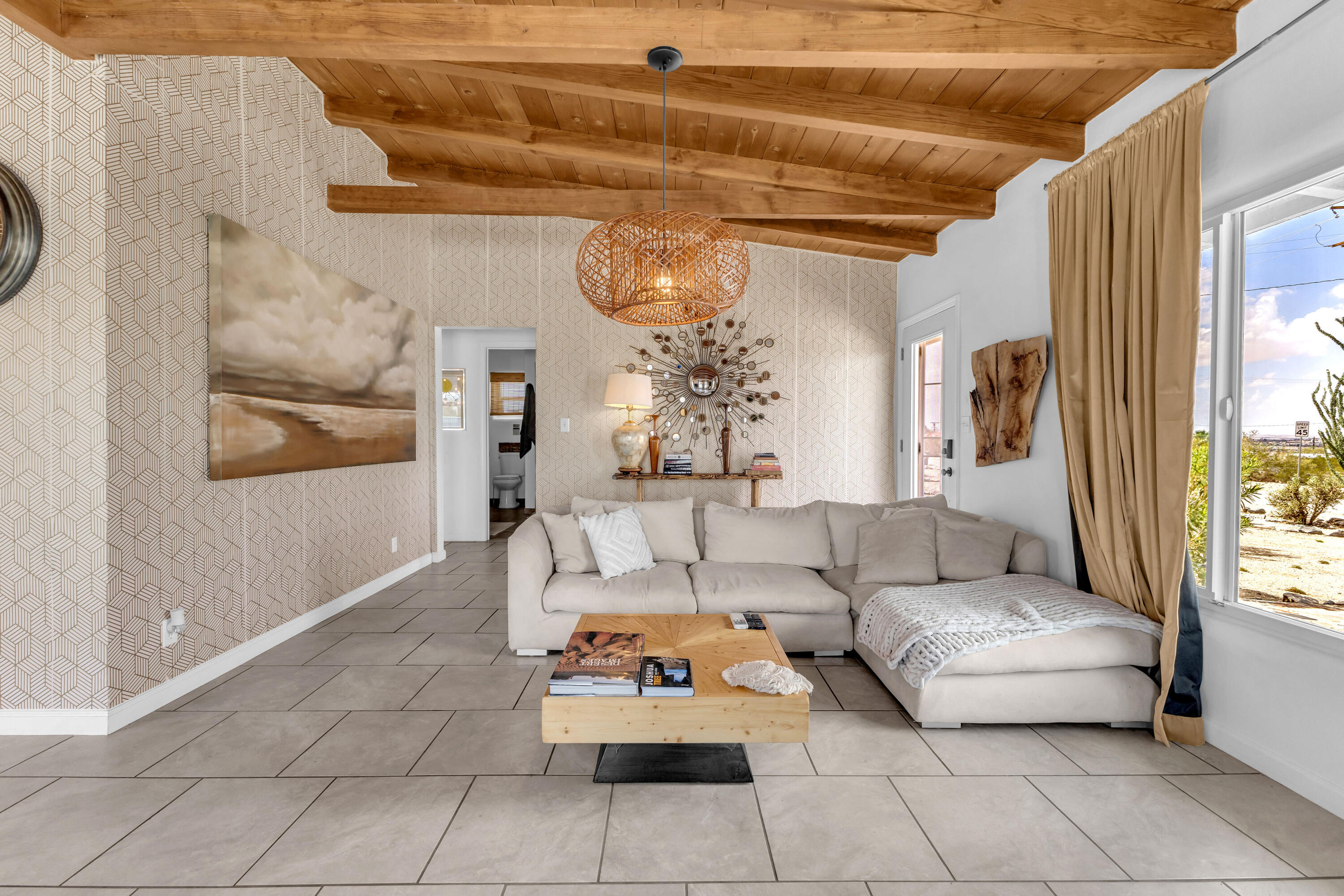 75047 Baseline Road Twentynine Palms, CA 92277 - Photo 23 of 47 a living room with furniture and a window