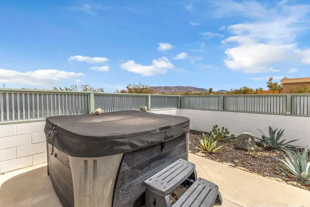 a terrace with outdoor seating and city view