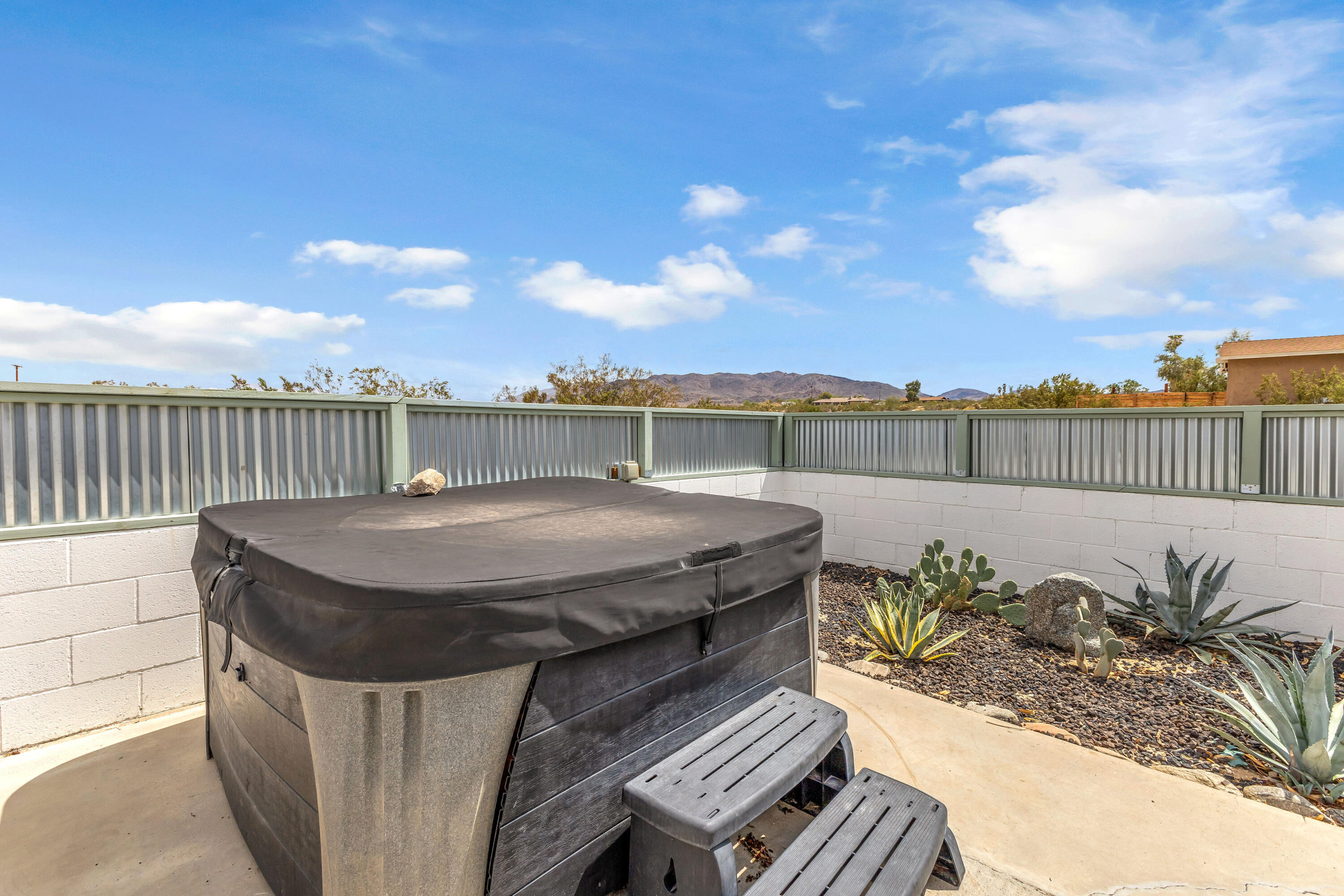 75047 Baseline Road Twentynine Palms, CA 92277 - Photo 32 of 47 a terrace with outdoor seating and city view