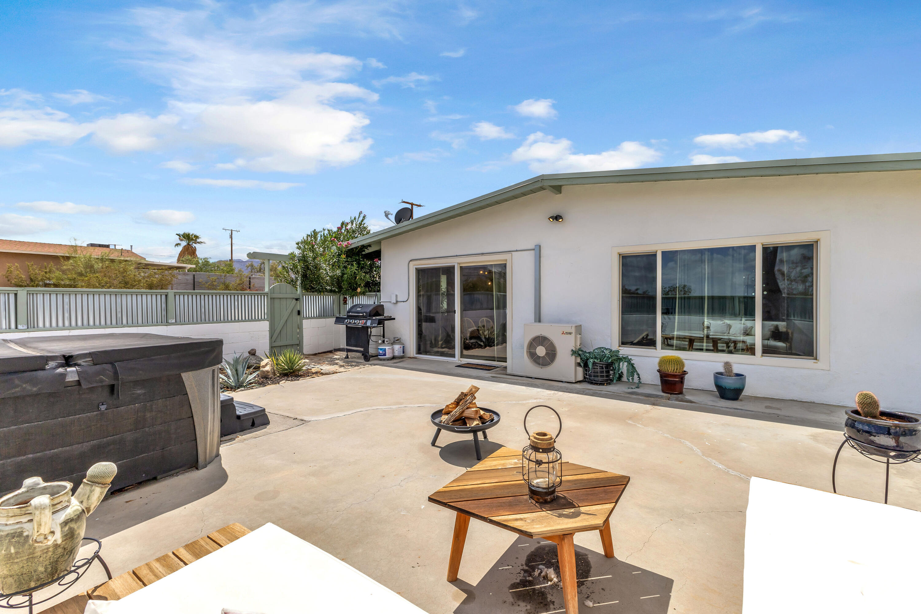 75047 Baseline Road Twentynine Palms, CA 92277 - Photo 34 of 47 a swimming pool with outdoor seating and barbeque oven