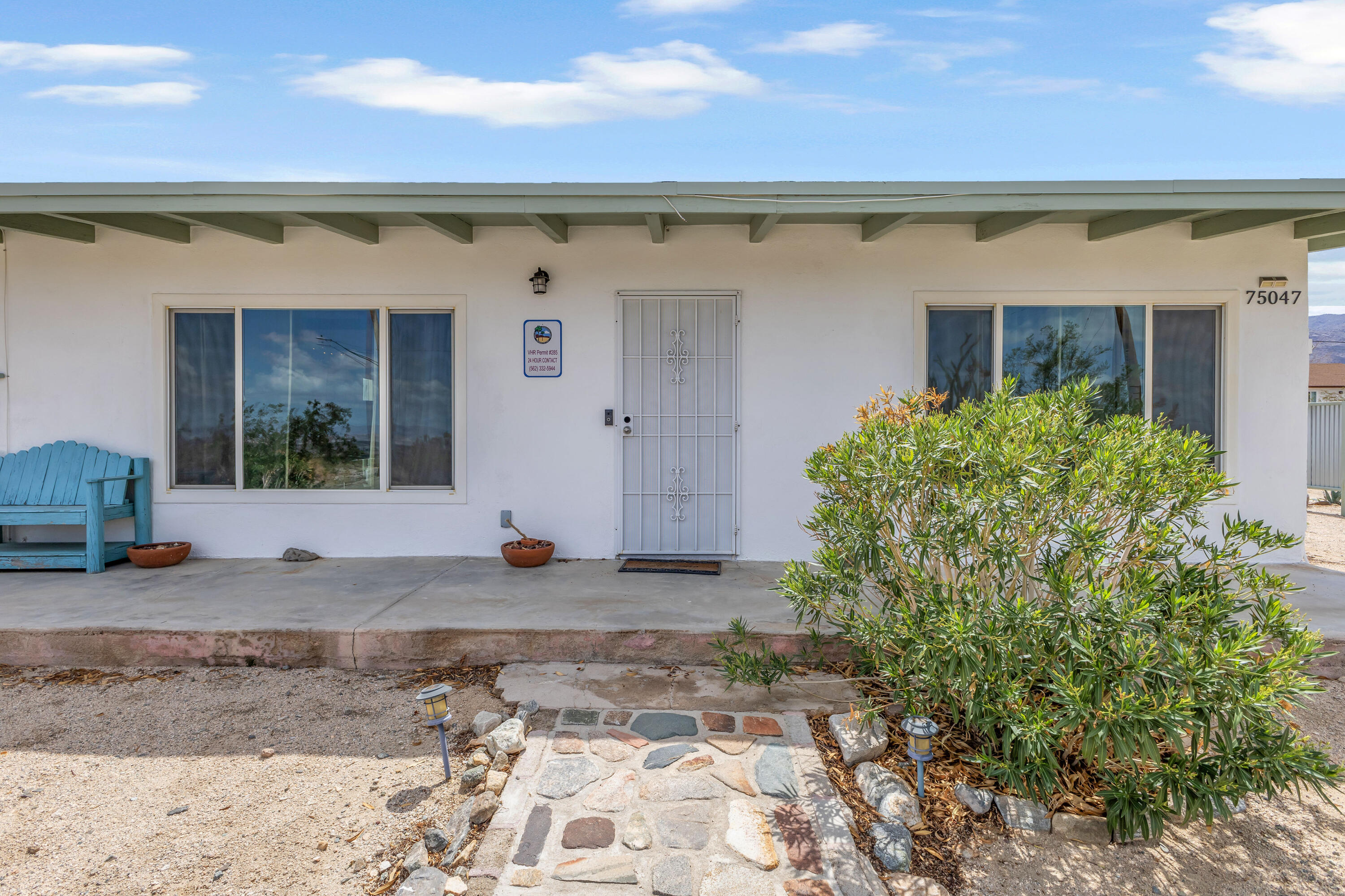 75047 Baseline Road Twentynine Palms, CA 92277 - Photo 6 of 47 a view of a house with a tree in front of it