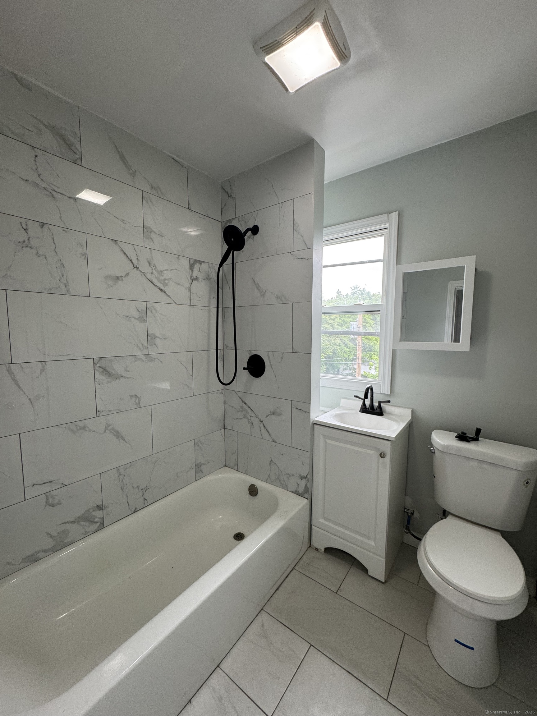 199 English Street, Unit 2 New Haven, CT 06513 - Photo 4 of 10 a bathroom with a bathtub toilet and sink