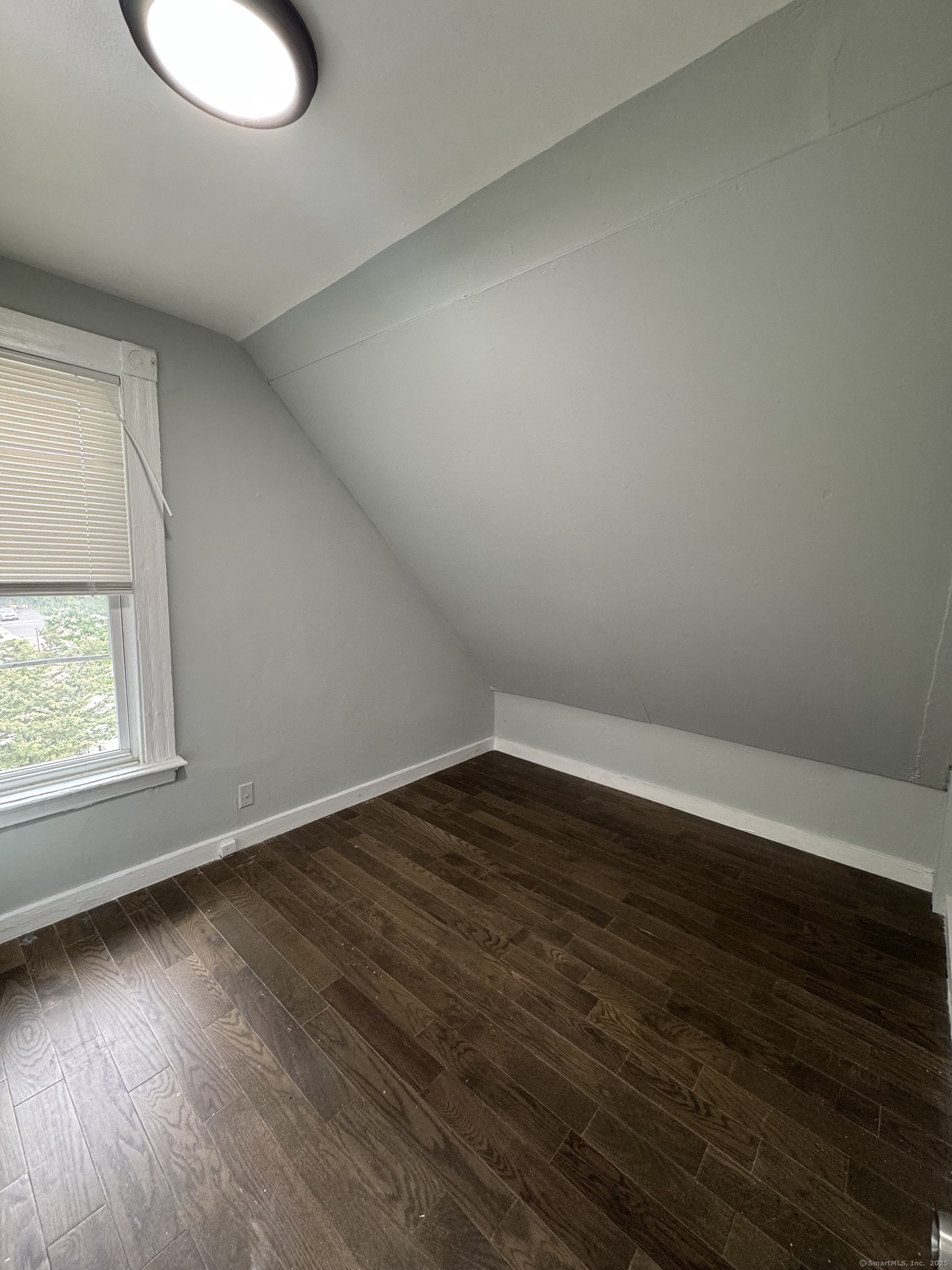 199 English Street, Unit 2 New Haven, CT 06513 - Photo 8 of 10 an empty room with wooden floor and windows