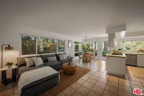 a kitchen with a table and chairs