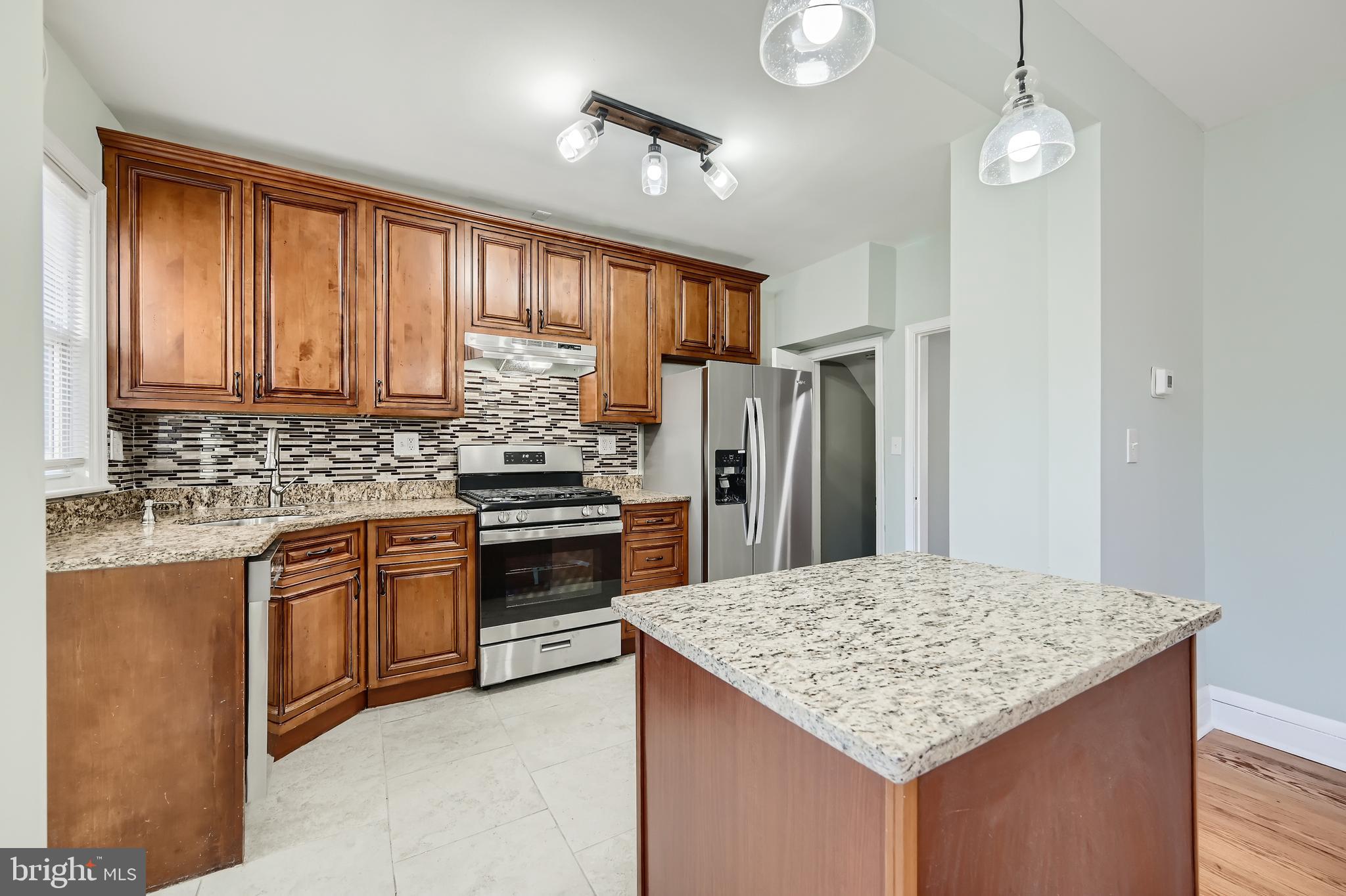 1513 Shadyside Road Baltimore, MD 21218 - Photo 11 of 37 Granite Countertops & Oak Cabinetry