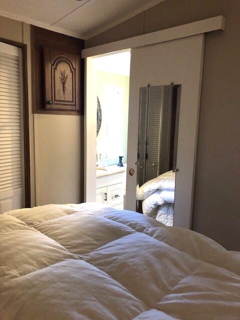 55 Boca Chica Road, Unit 32 Key West, FL 33040 - Photo 14 of 27 a bedroom with a bed and a window