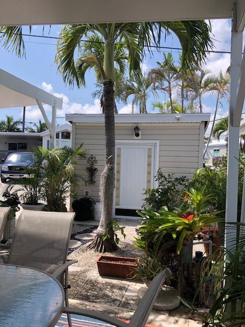 55 Boca Chica Road, Unit 32 Key West, FL 33040 - Photo 16 of 27 a potted plant sitting in front of a building