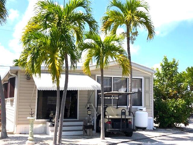 55 Boca Chica Road, Unit 32 Key West, FL 33040 - Photo 2 of 27 a front view of multiple house with palm trees