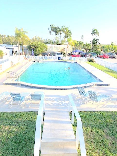 55 Boca Chica Road, Unit 32 Key West, FL 33040 - Photo 21 of 27 a view of a swimming pool and a yard