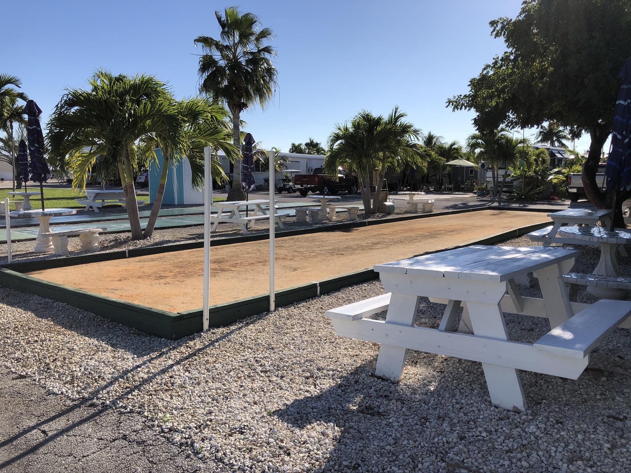 55 Boca Chica Road, Unit 32 Key West, FL 33040 - Photo 22 of 27 a view of a backyard with swimming pool