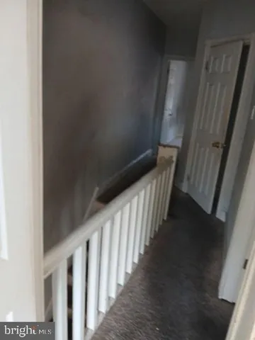 a white toilet sitting next to a shower