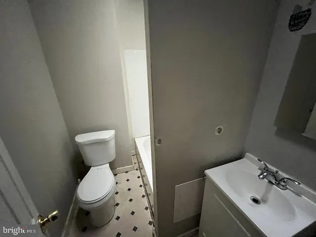 a bathroom with a white bath tub and a roof