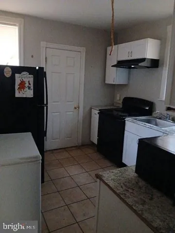 a view of staircase and a stove