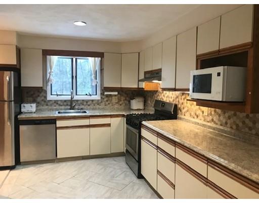 20 Hawthorne Road Holbrook, MA 02343 - Photo 3 of 22 a kitchen with stainless steel appliances granite countertop a sink stove and microwave