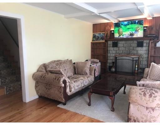 20 Hawthorne Road Holbrook, MA 02343 - Photo 5 of 22 a living room with furniture and a fireplace