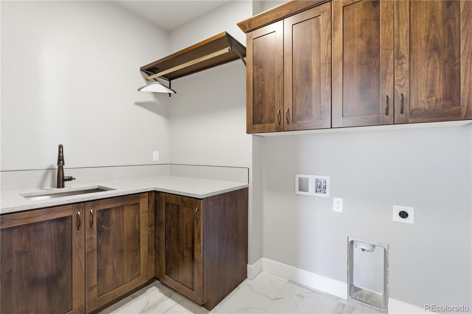 1908 Tidewater Lane Windsor, CO 80550 - Photo 20 of 41 a bathroom with a sink and mirror