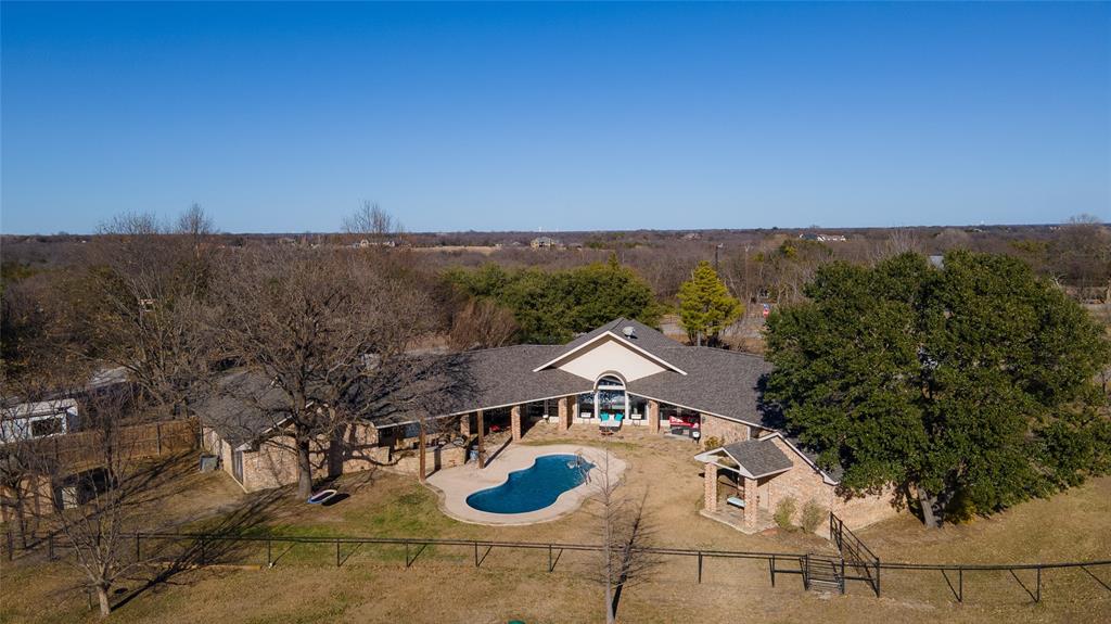 an aerial view of a house with garden space