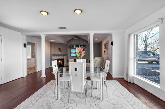 a view of a dining room with furniture window and wooden floor
