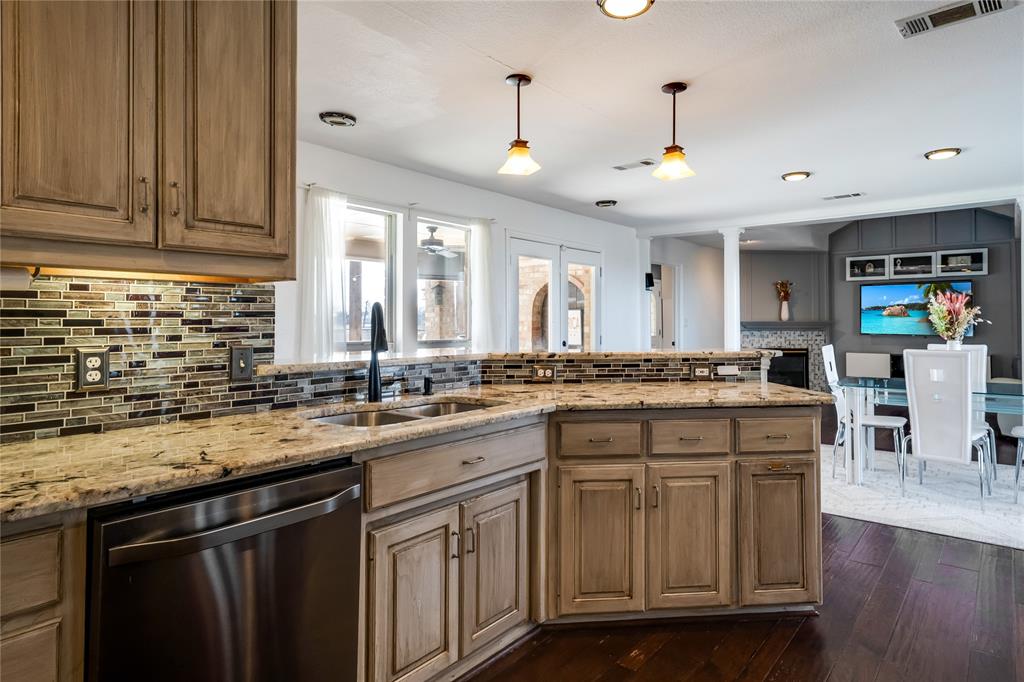 750 Long Road Lucas, TX 75002 - Photo 15 of 39 a kitchen with a sink stove and cabinets