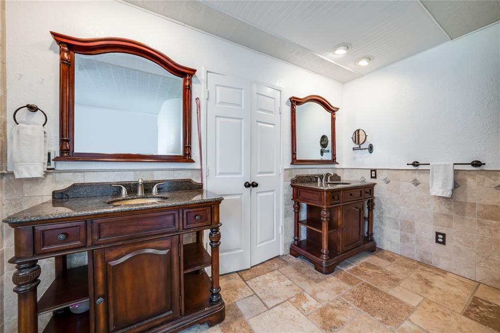 750 Long Road Lucas, TX 75002 - Photo 21 of 39 a bathroom with a sink and a mirror