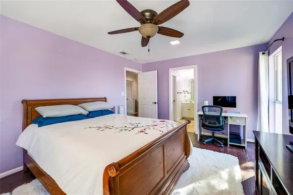 a bed room with a bed and a television