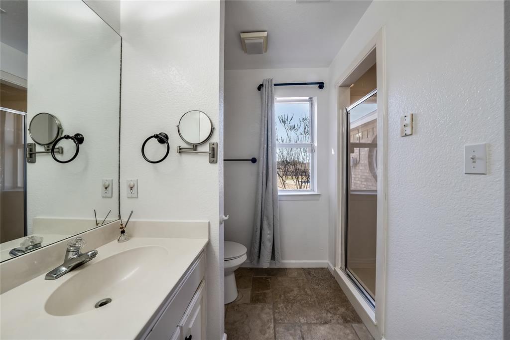750 Long Road Lucas, TX 75002 - Photo 27 of 39 a bathroom with a sink and a mirror