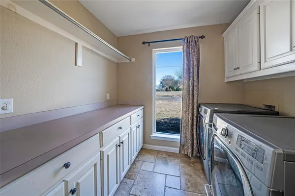 a kitchen with a stove and a refrigerator