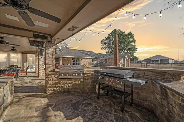 a view of a chairs and table in the patio