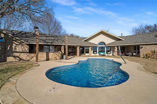 a view of a house with roof deck and sitting area