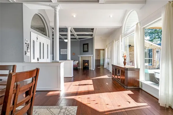 a view of living room kitchen with furniture and fireplace