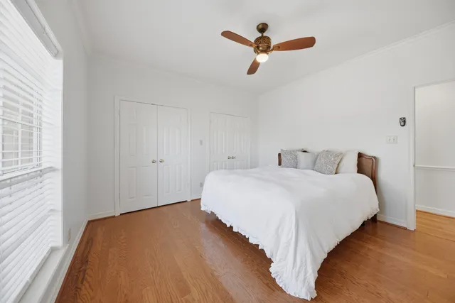 a bedroom with bed and window
