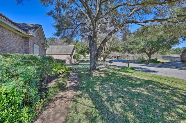 a backyard of a house with lots of green space