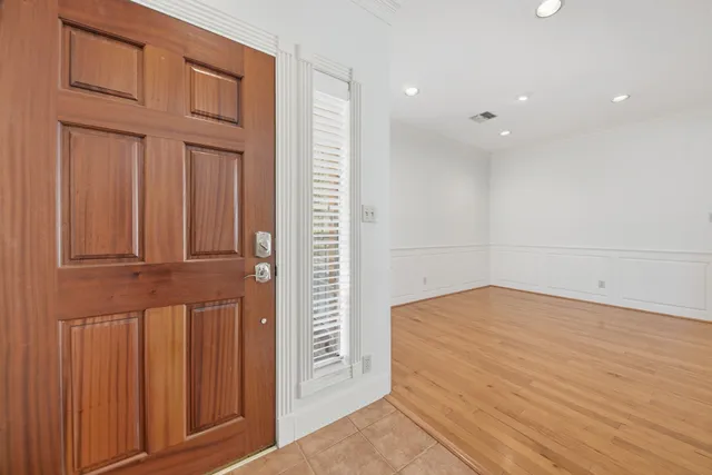 an empty room with wooden floor