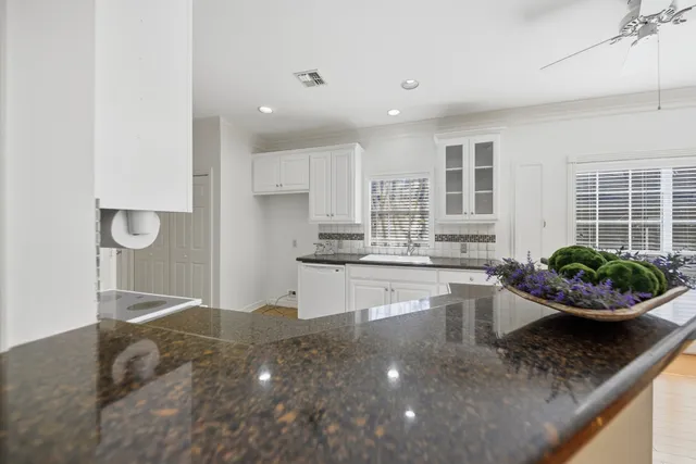 a kitchen with a sink and a stove top oven