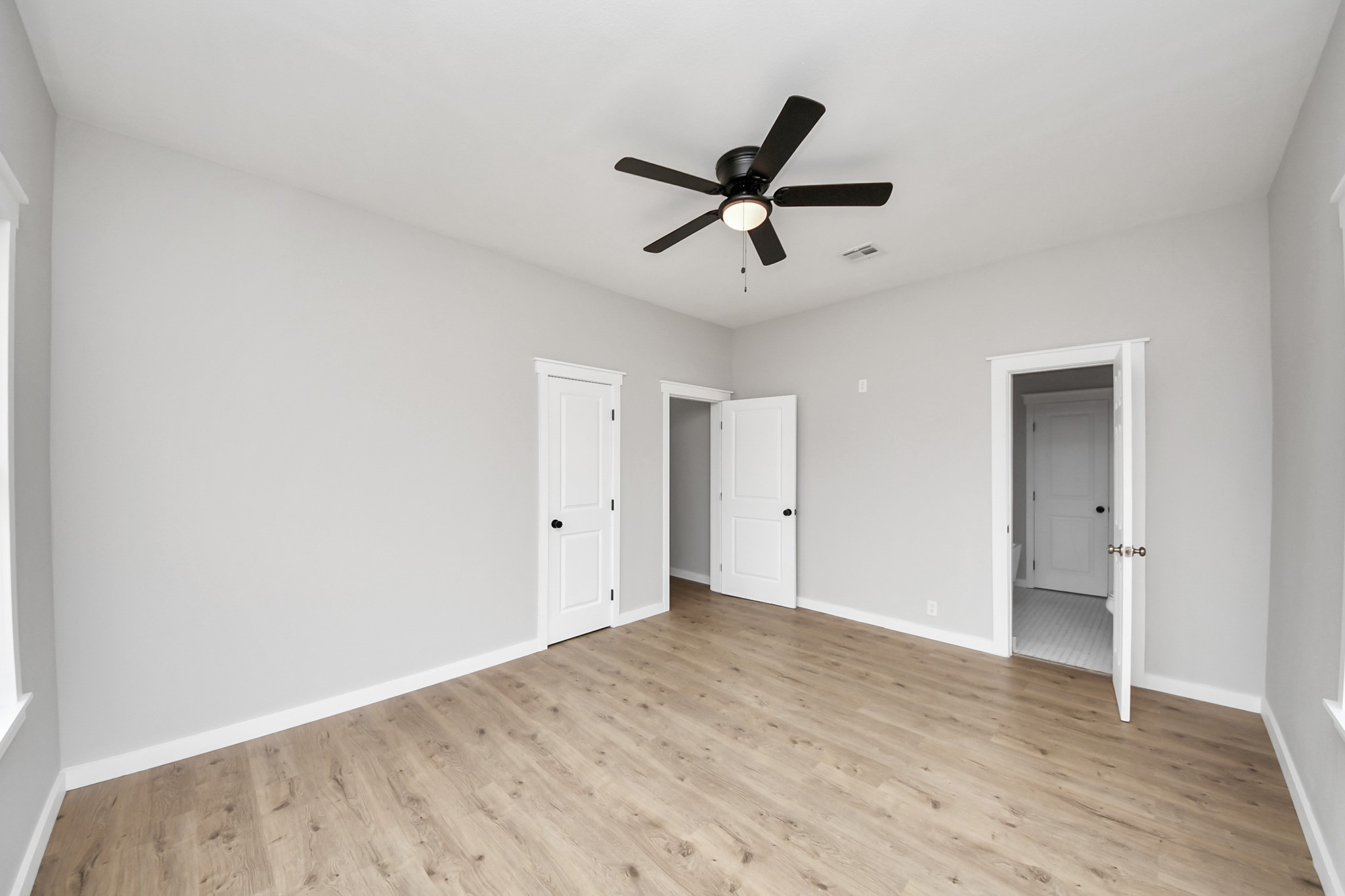 1507 Brooks Avenue Rosenberg, TX 77471 - Photo 15 of 35 a view of a big room with wooden floor and windows