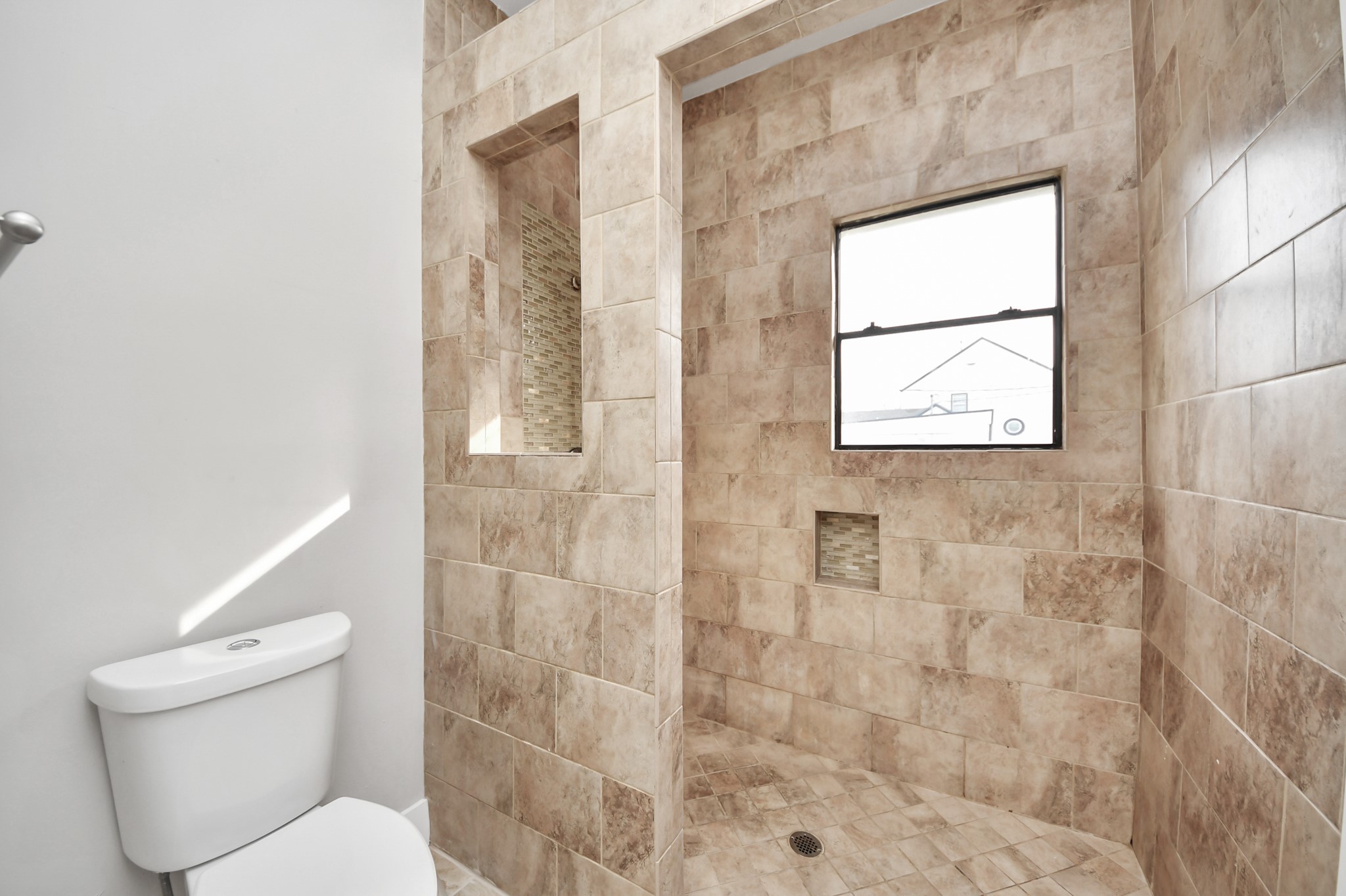 1507 Brooks Avenue Rosenberg, TX 77471 - Photo 20 of 35 a white toilet sitting next to a bathroom sink