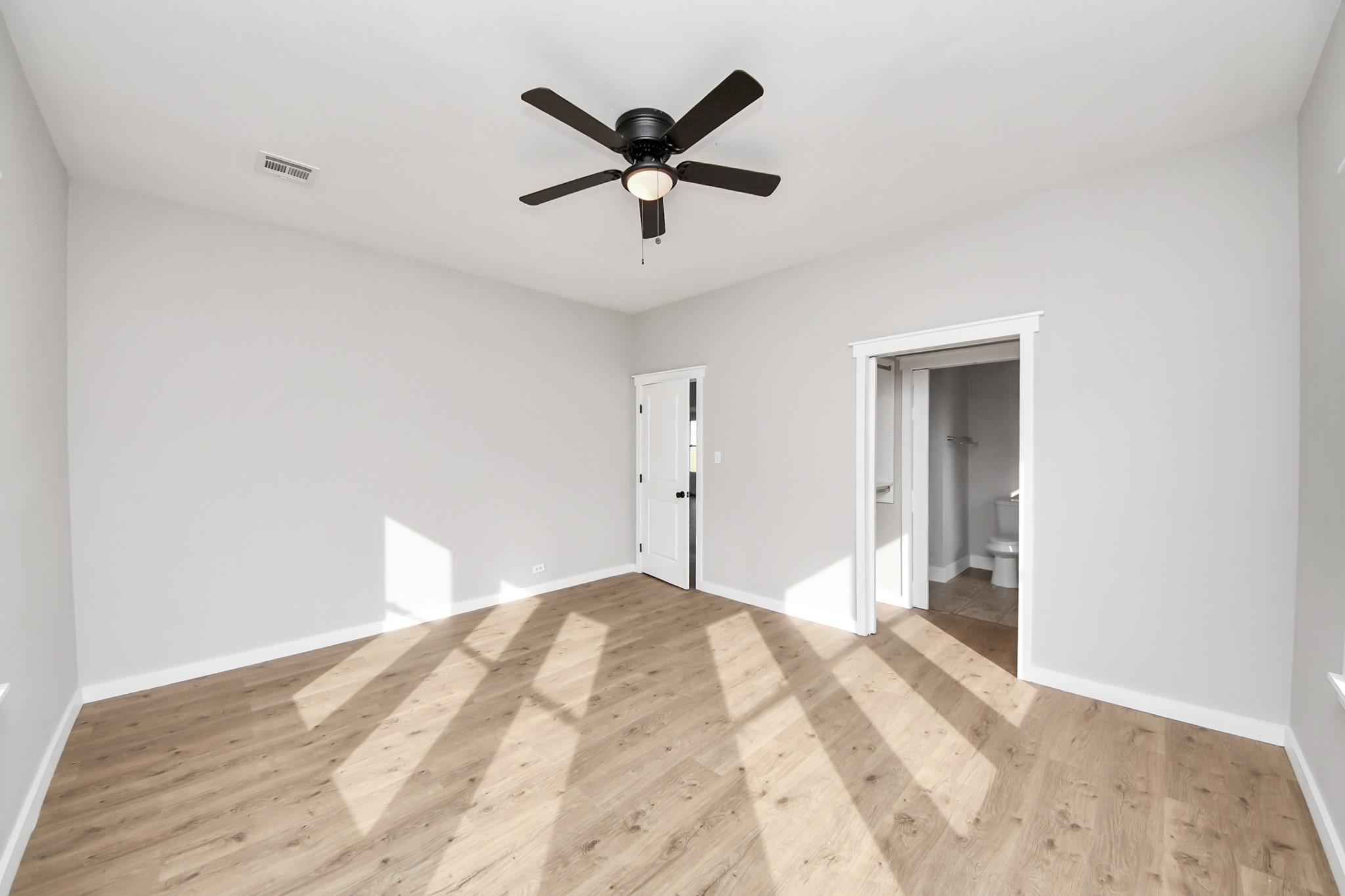 1507 Brooks Avenue Rosenberg, TX 77471 - Photo 23 of 35 a bedroom with a bed and a ceiling fan