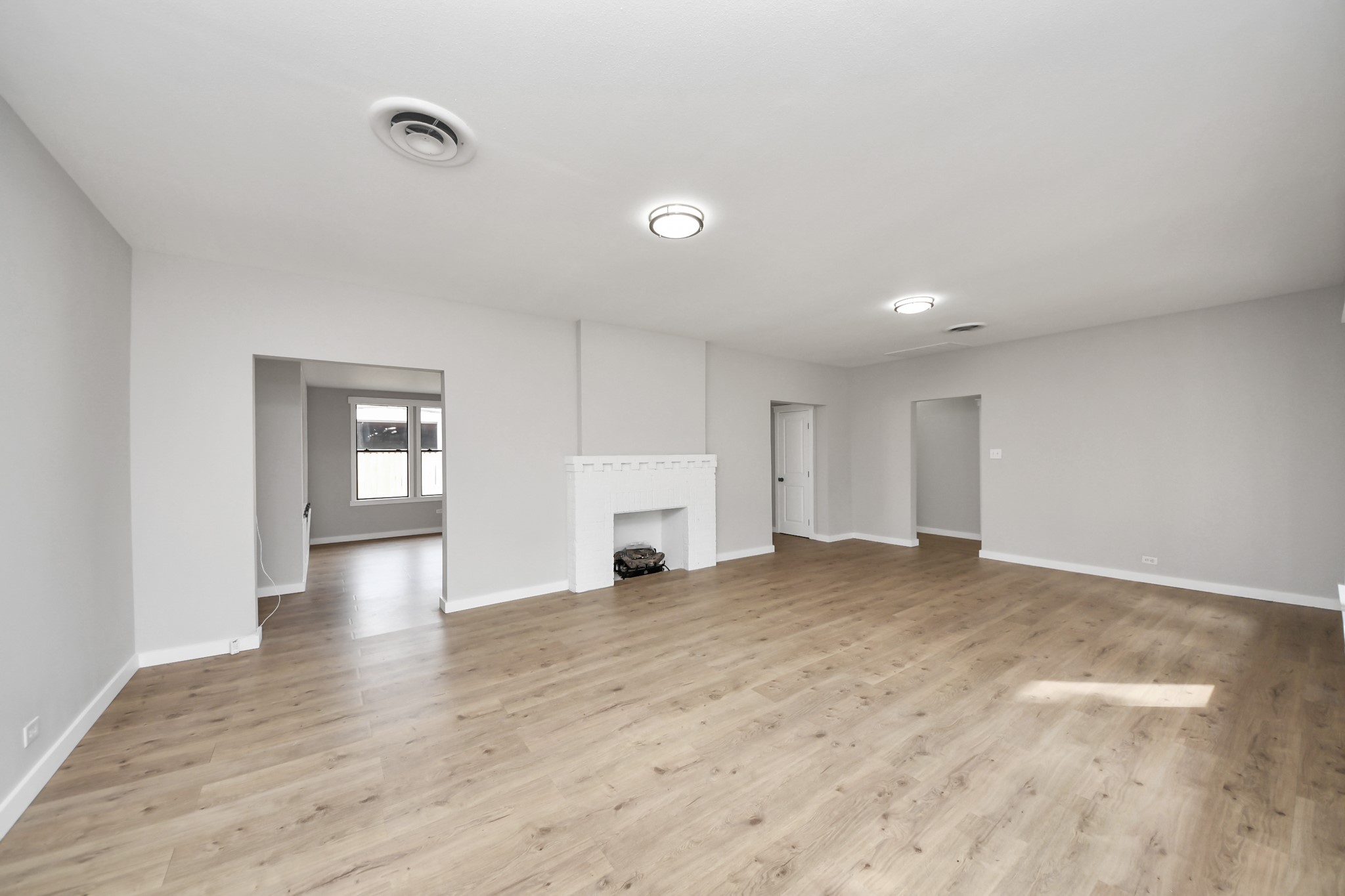 1507 Brooks Avenue Rosenberg, TX 77471 - Photo 8 of 35 a view of empty room with wooden floor and entryway