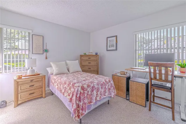 a bedroom with a bed and a table