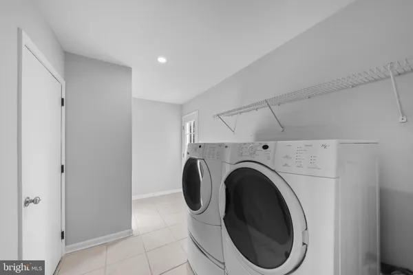 a view of a hallway with washer and dryer