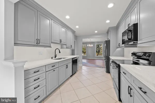 a kitchen with cabinets and appliances