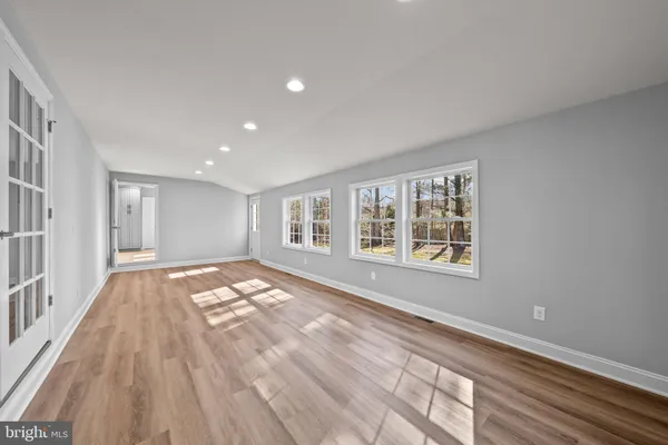 a view of an empty room and a window