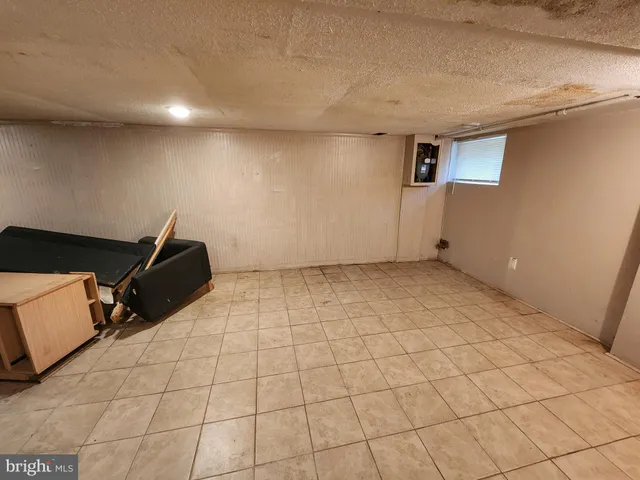 a room with gym equipment and stairs