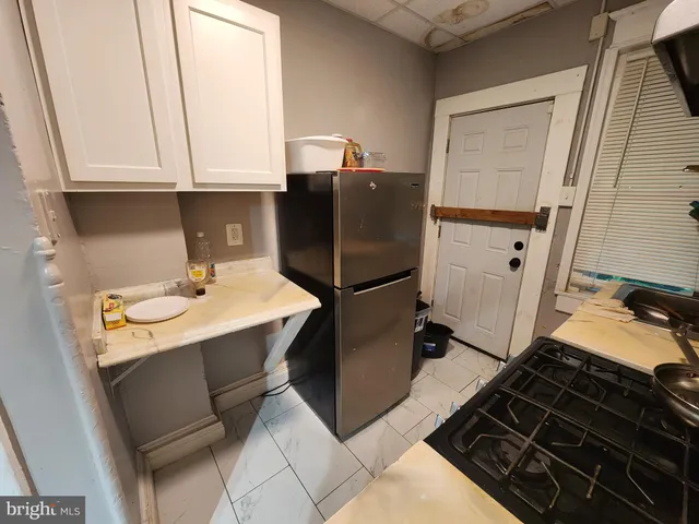 a kitchen with a sink appliances and cabinets