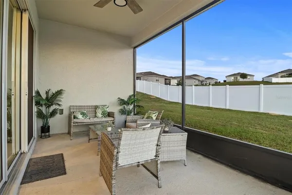 a patio with table and chairs