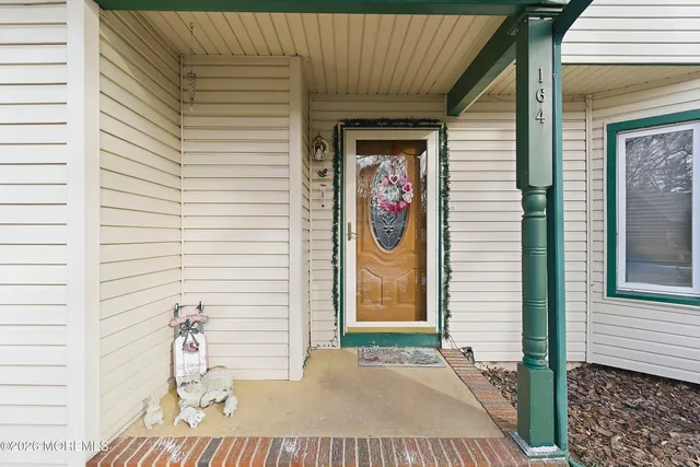a view of a door and a window