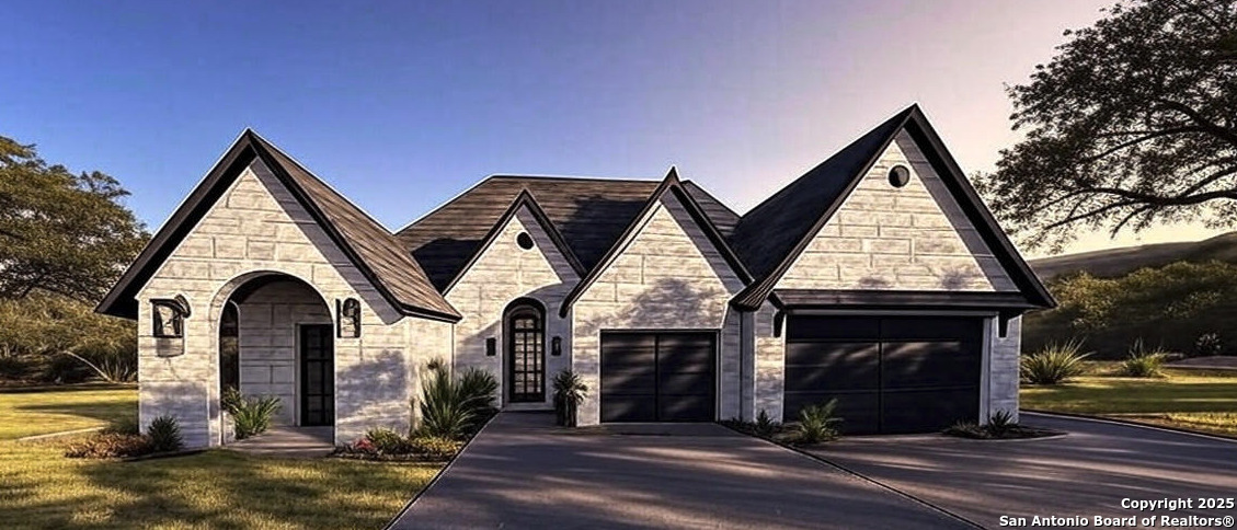 a view of house with entertaining space and glass windows