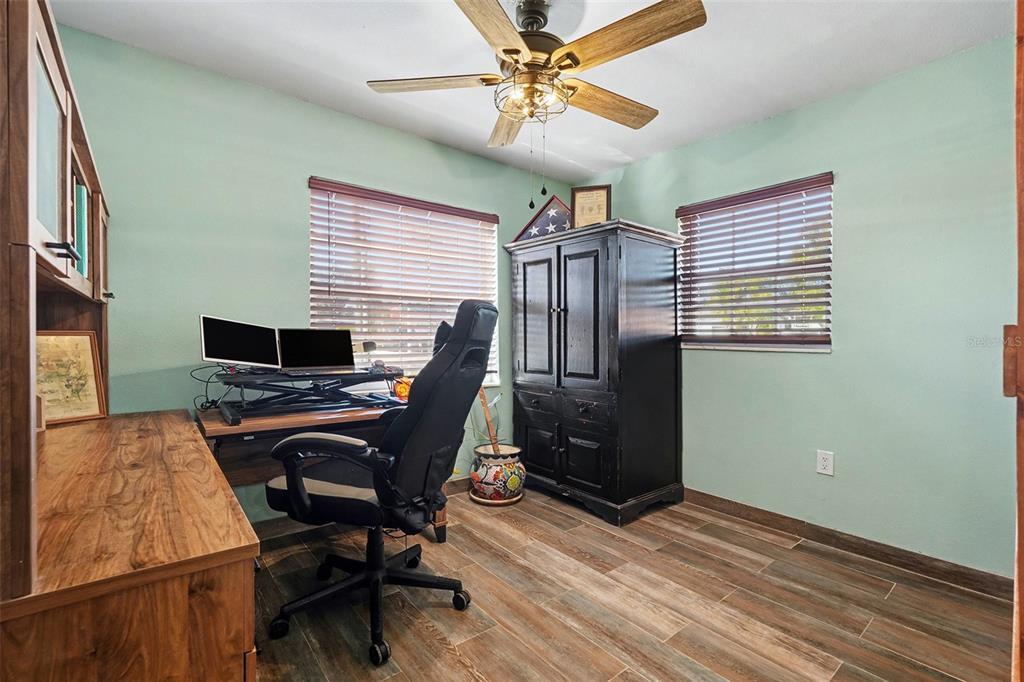 557 Flame Tree Drive Apollo Beach, FL 33572 - Photo 21 of 31 a view of a workspace with furniture and a window