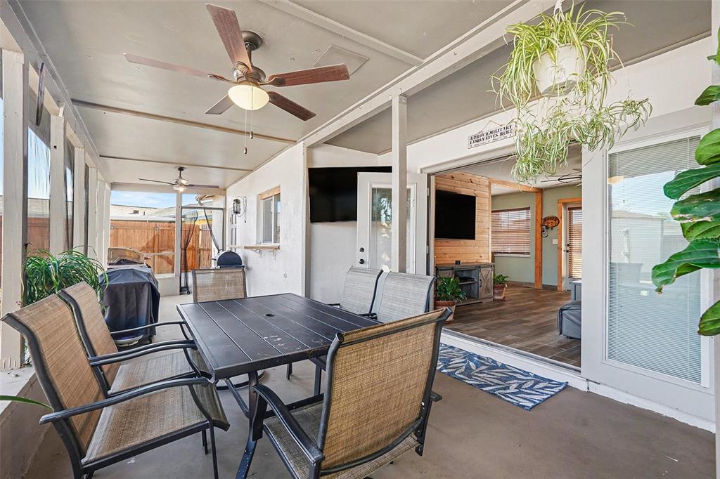 557 Flame Tree Drive Apollo Beach, FL 33572 - Photo 24 of 31 a view of a dining room with furniture window and wooden floor