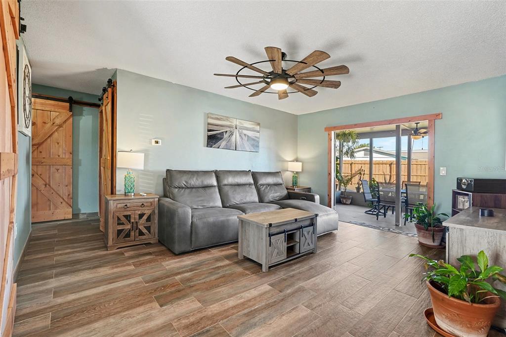 557 Flame Tree Drive Apollo Beach, FL 33572 - Photo 6 of 31 a living room with furniture and a large window